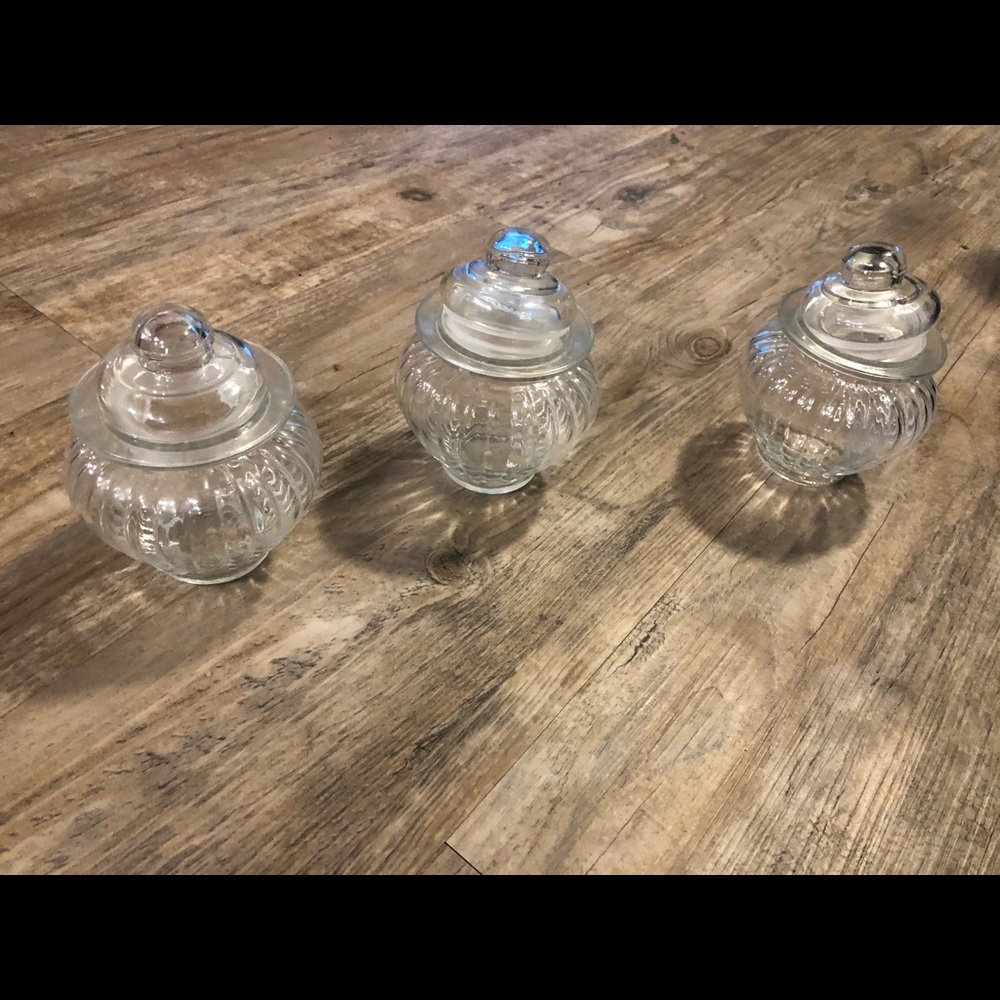 Three small glass jars